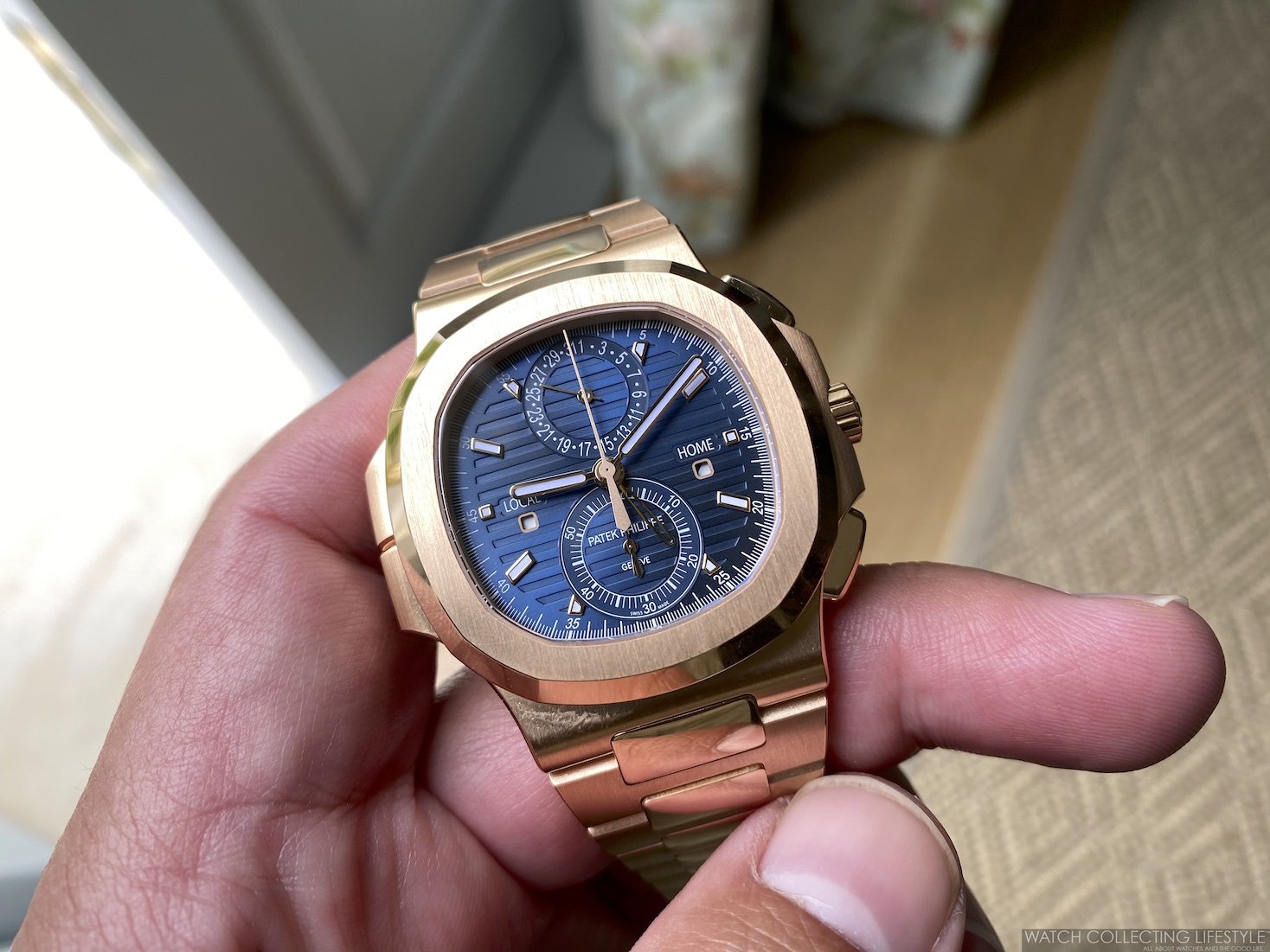 Patek Philippe Nautilus Travel Time 5990/1R: A Luxurious 18k Rose Gold Timepiece